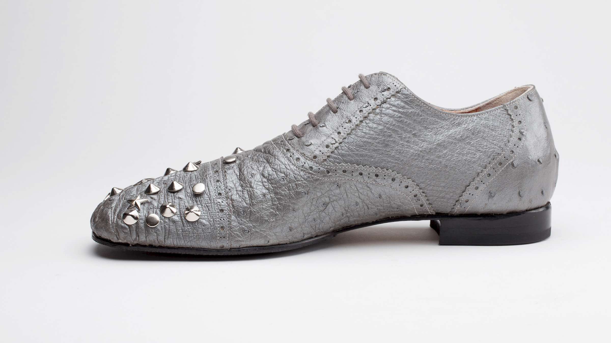 silver ostrich leather bespoke ladies shoe with rivets side view