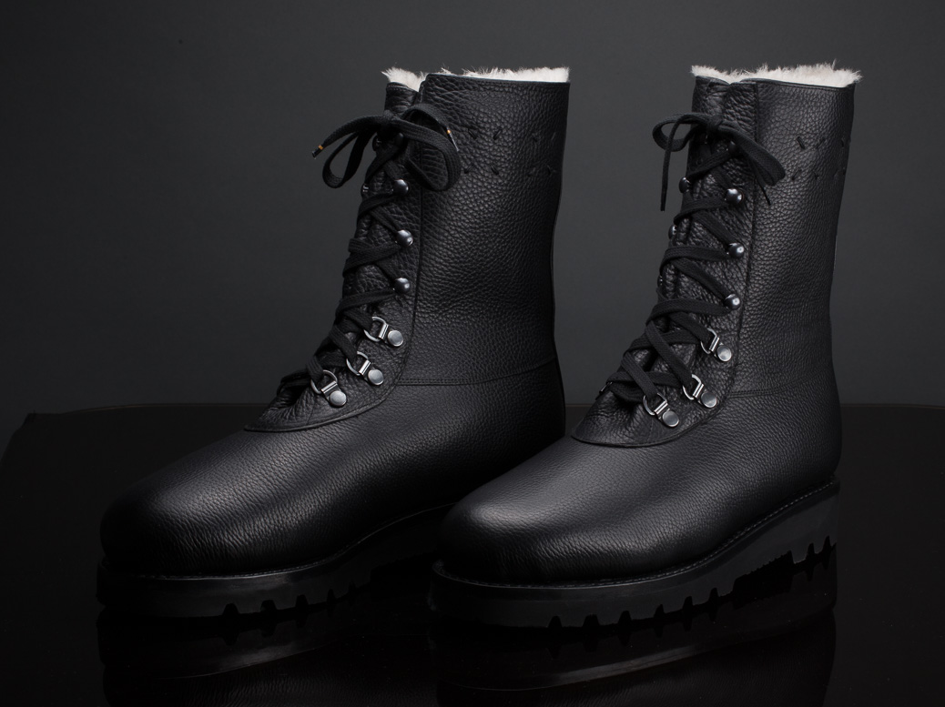 bespoke black winter boot with lambskin and Goretex membrane on dark background