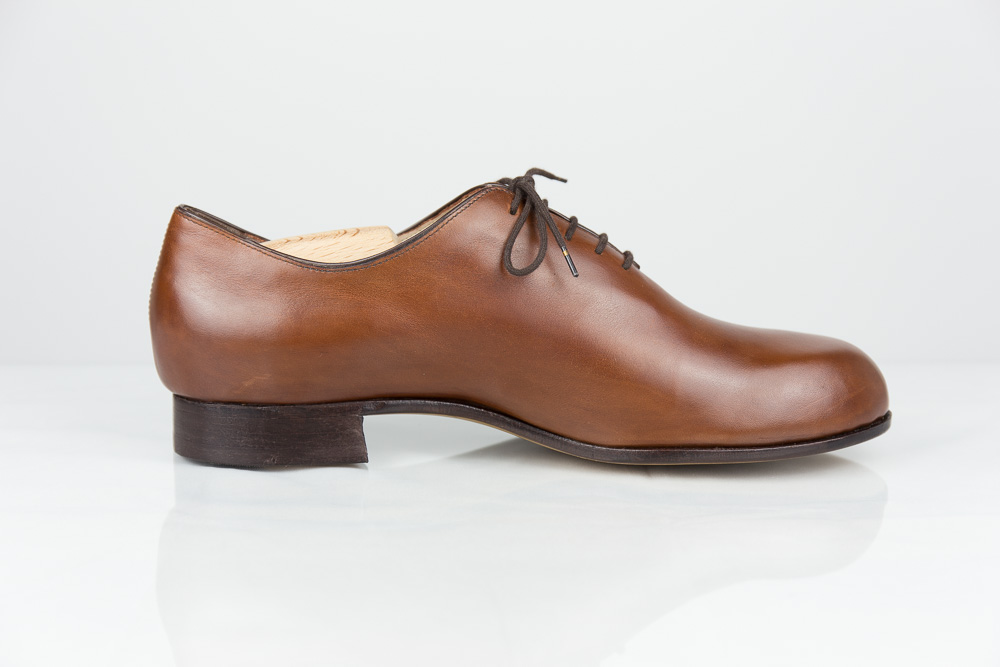 One piece bespoke men shoe cognac-coloured leather side view