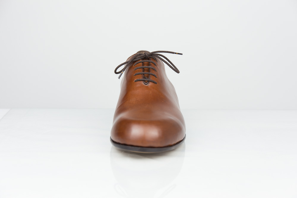 One piece bespoke men shoe cognac-coloured leather front view